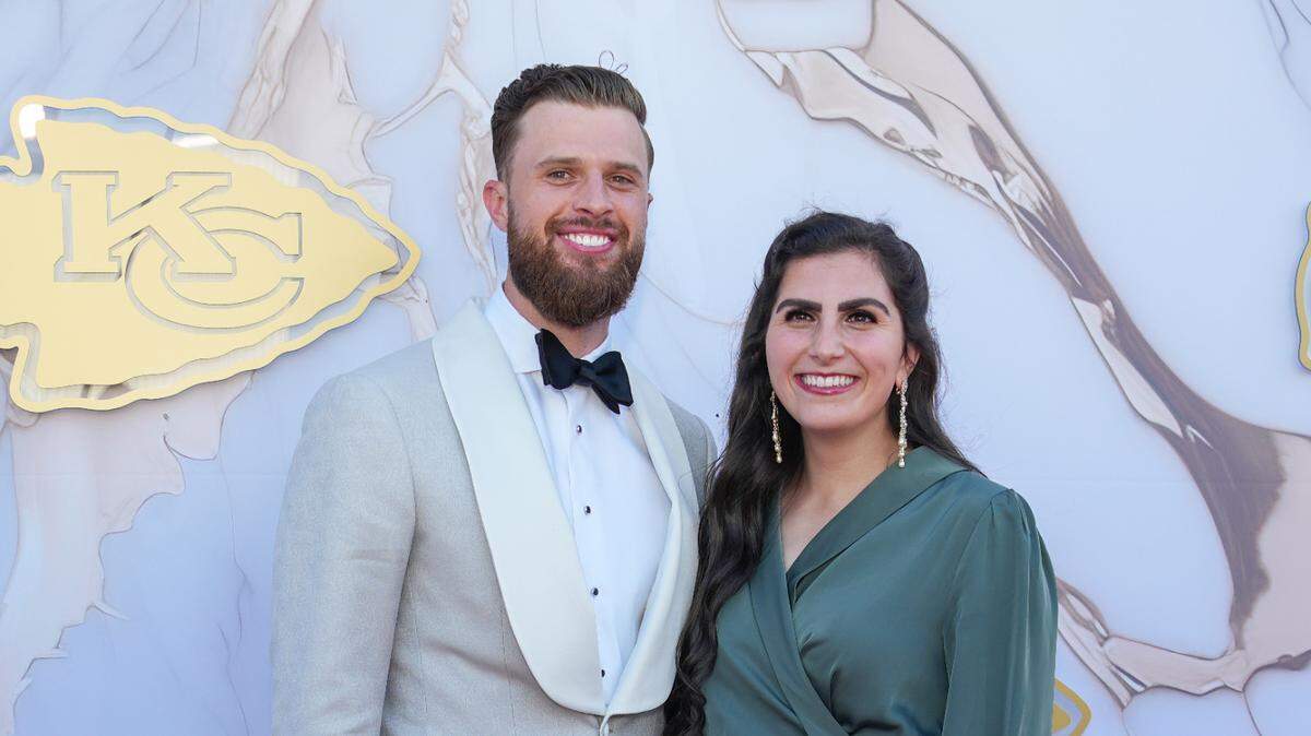 Kansas City Chiefs Harrison Butker and wife, Isabelle, pose for a photo on the Red Carpet at the Nelson Art Gallery in 2024.