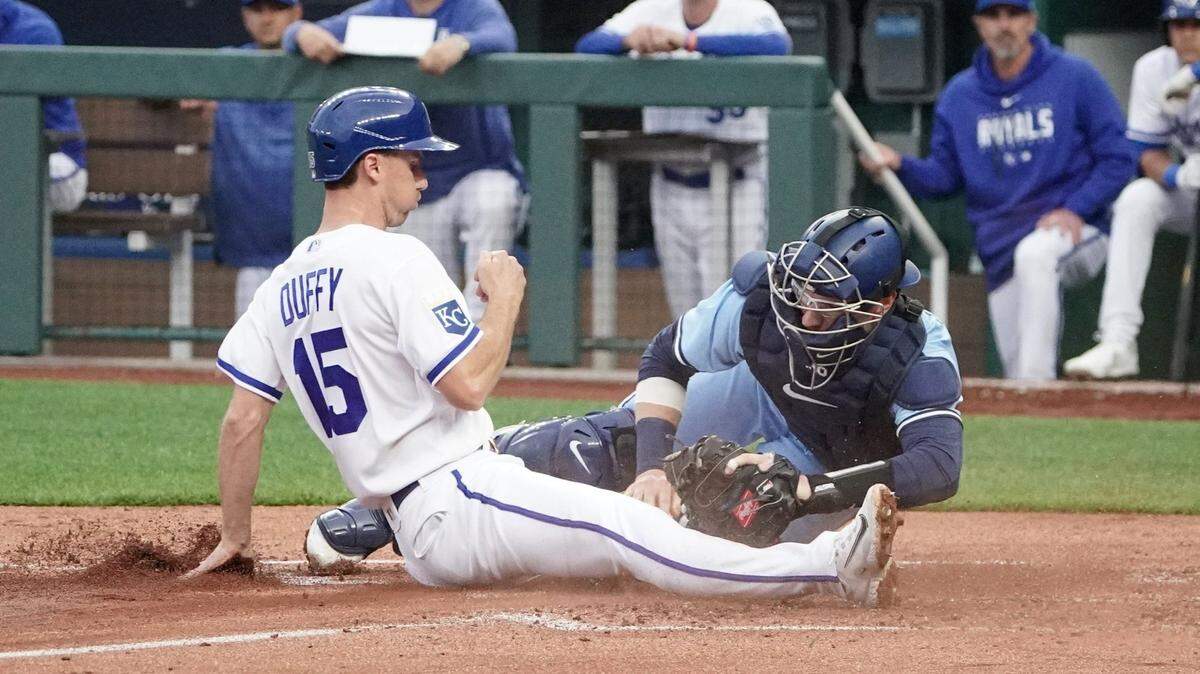 Toronto Blue Jays catcher Danny Jansen (9) tags out Kansas City Royals third baseman Matt Duffy (15) at home plate during the third inning at Kauffman Stadium on April 4, 2023.