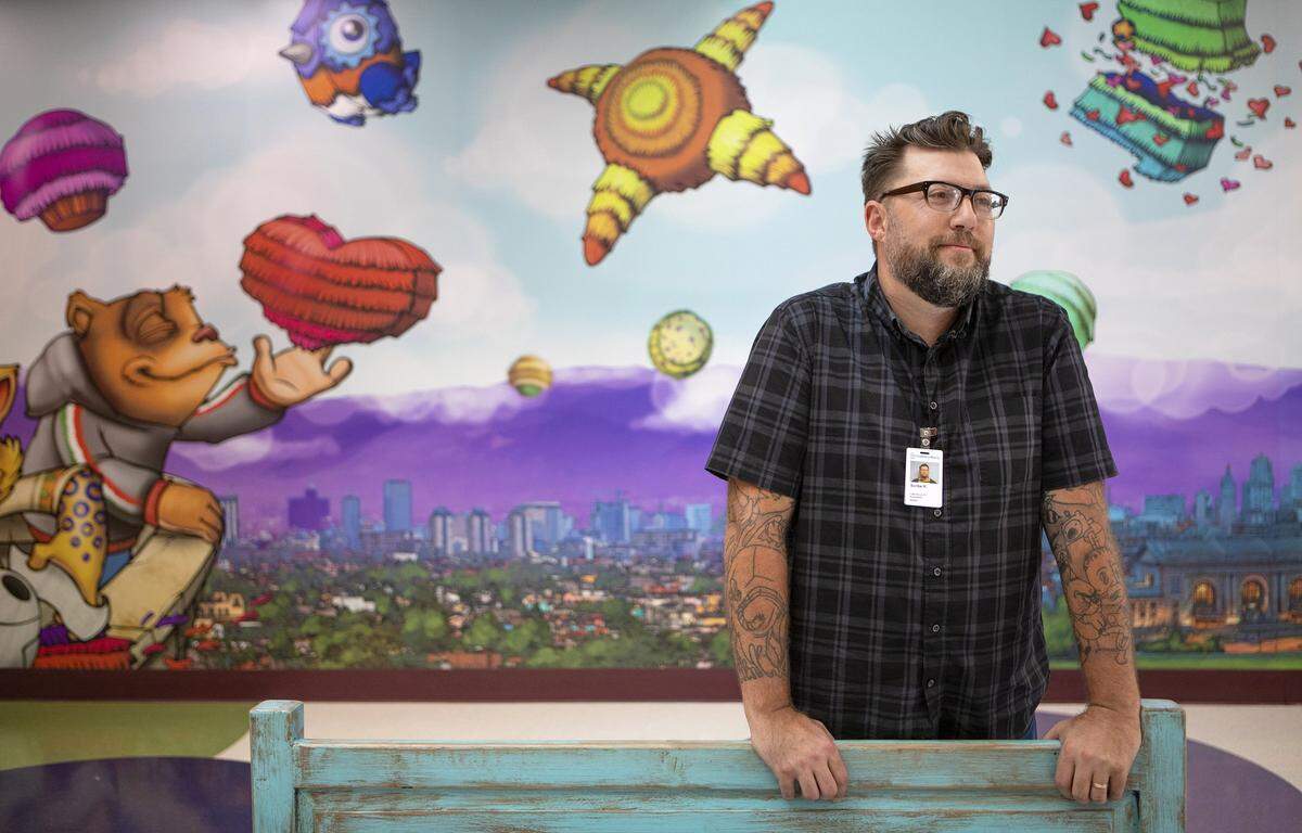 “I picture him as like a walking 3-D employee of the hospital that’s helping people,” artist Donald “Scribe” Ross said of the bears on the construction signs.
