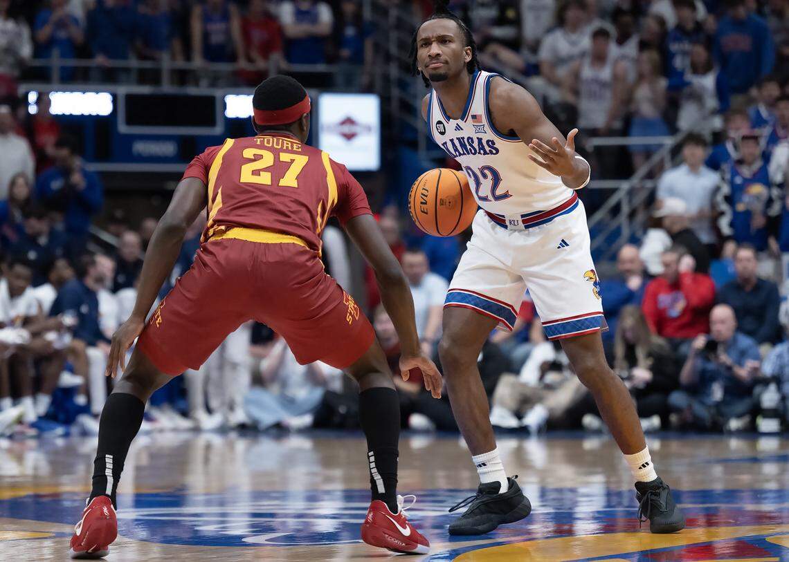 Kansas Jayhawks guard Darryn Peterson (22) gestures as he handles the ball as Iowa State Cyclones guard Killyan Toure (27) defends in the first half on Tuesday, Jan. 13, 2026, at Allen Fieldhouse in Lawrence.