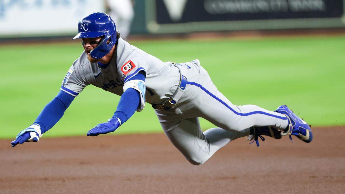 Kansas City Royals shortstop Bobby Witt Jr. (7) slides into third with a triple against the Houston Astros in the first inning at Daikin Park on May 14, 2025 in Houston, Texas, USA.