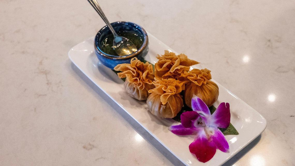 Penny’s Treasure Bags, featuring seasoned chopped chicken, water chestnuts, mushrooms, sweet corn, carrots, and peas, hand-wrapped in paper-thin wontons, are served at Penny’s in The Village on Thursday, Jan. 9, 2025, in Prairie Village.