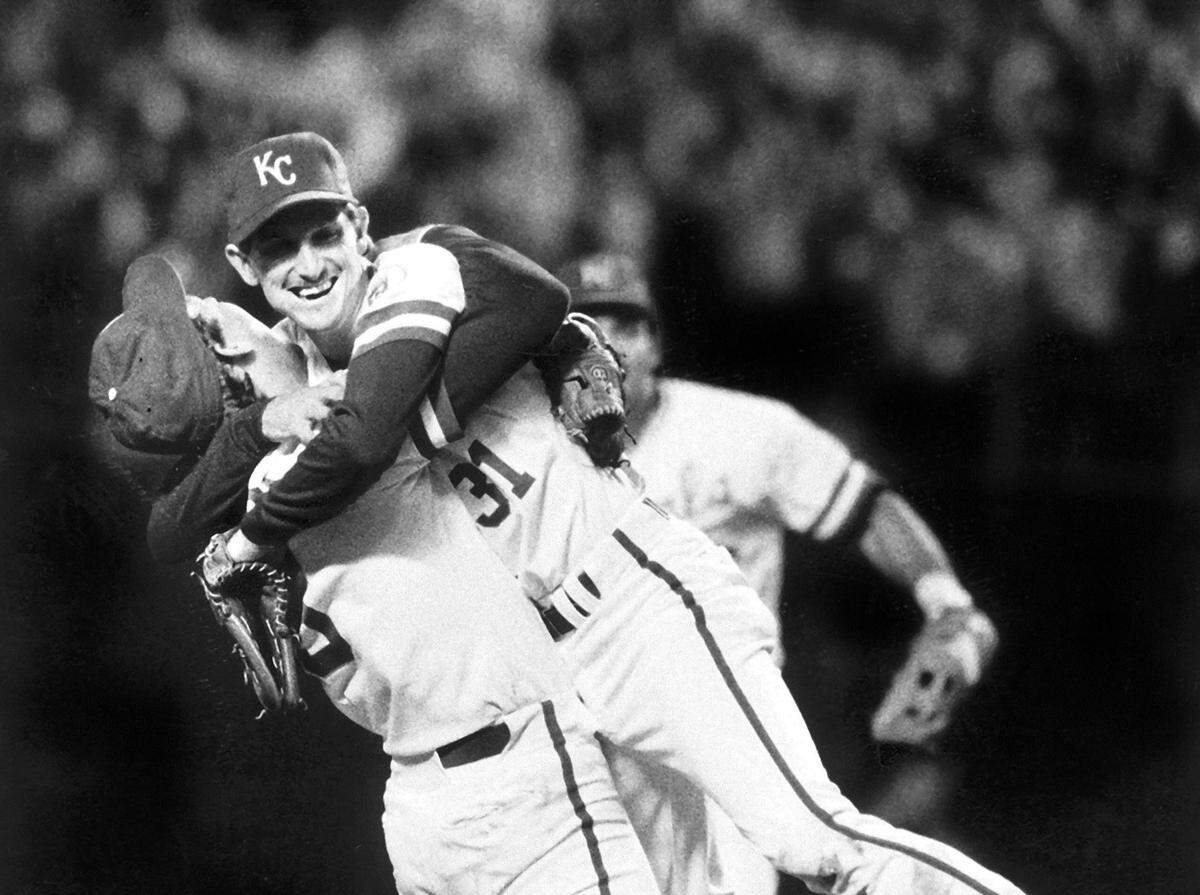 The Kansas City Royals defeated the St. Louis Cardinals to win the 1985 World Series. Having conquered  the baseball world, Royals slugger George Brett and pitcher Bret Saberhagen  hugged after the final out of the Series.