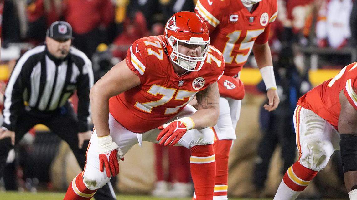Kansas City Chiefs guard Andrew Wylie (77) prepares to block for quarterback Patrick Mahomes (15) against the Pittsburgh Steelers in an AFC Wild Card playoff game at GEHA Field at Arrowhead Stadium on Jan. 16, 2022.
