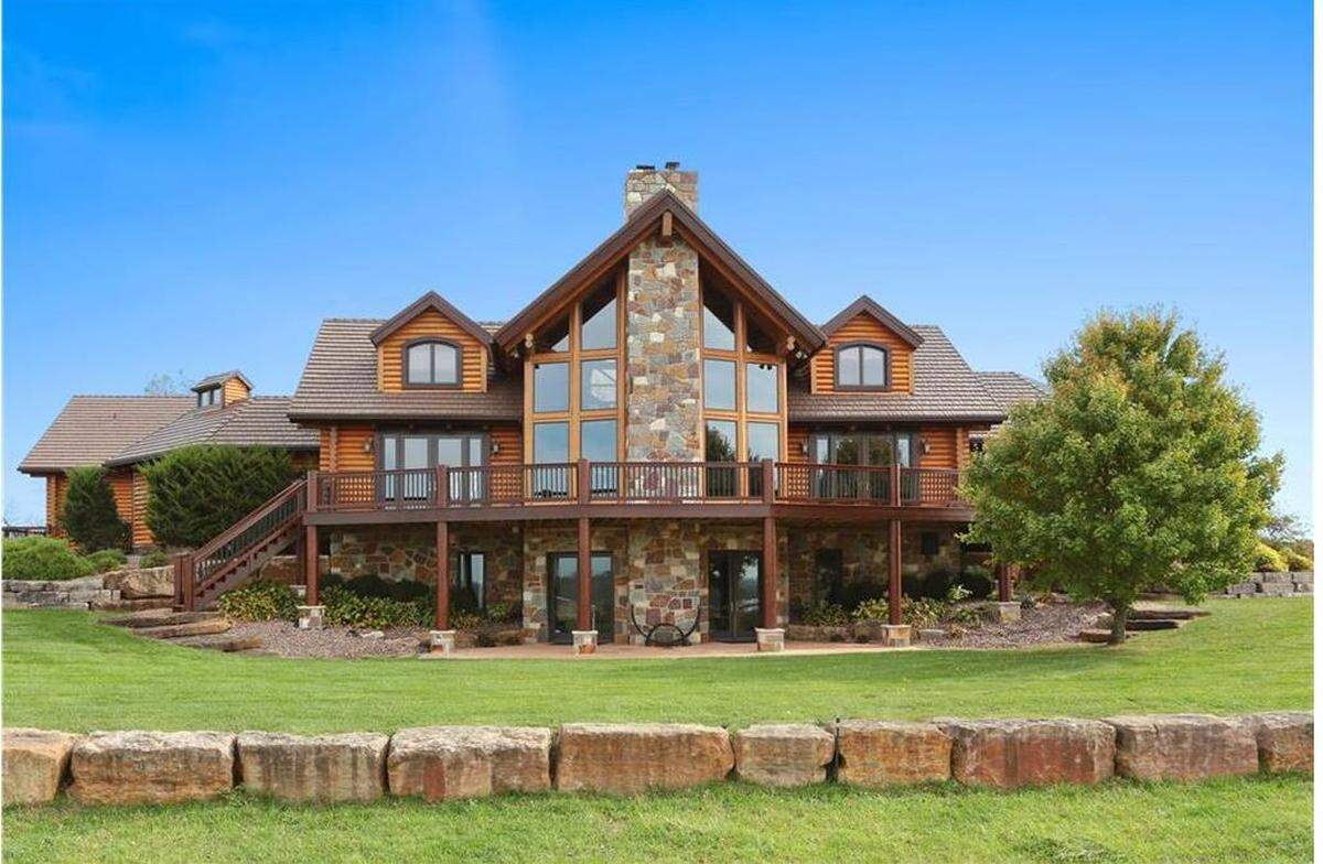 In Paola, Kansas, Wea Ranch was sold in 2019. The 8,500-square foot log home is set on 420 acres that include stables and a lake.