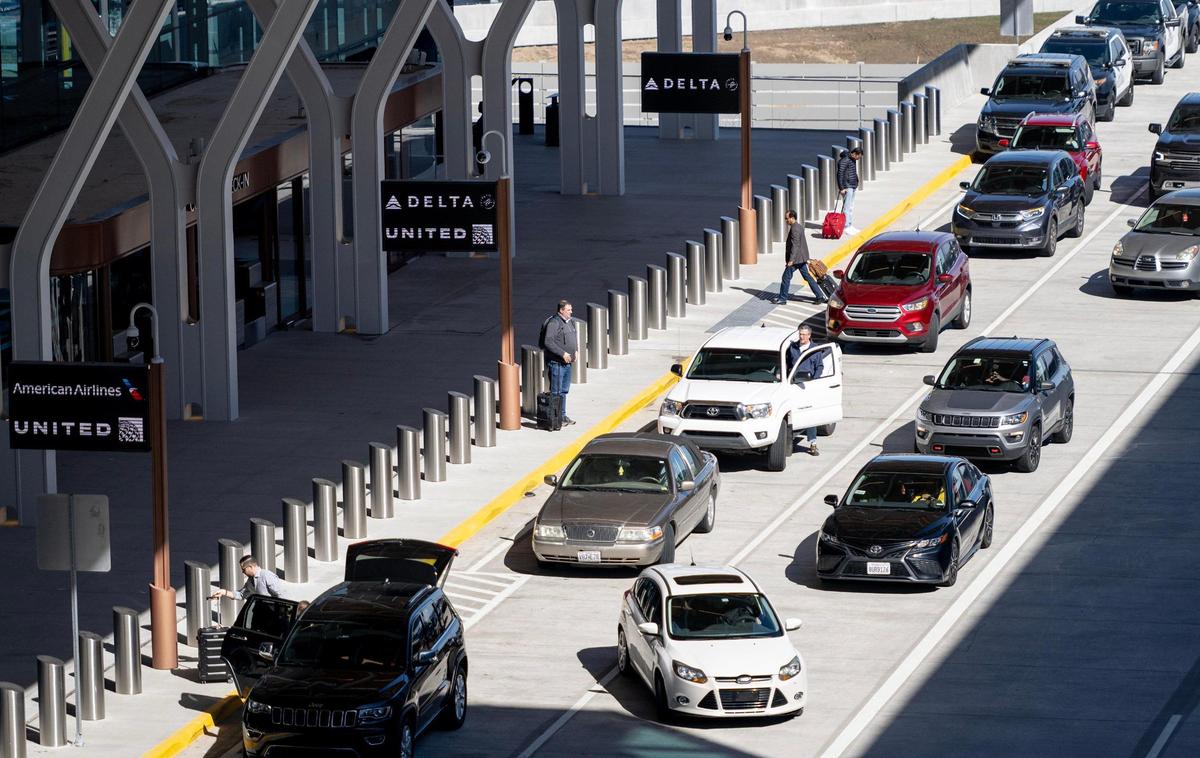 Vehicles maneuver the departure level drop-off area at Kansas City International Airport on Sunday, March 5, 2023, in Kansas City.