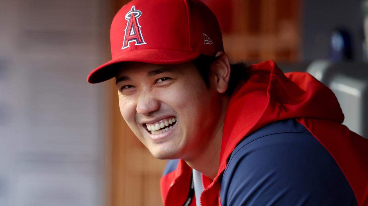 Los Angeles Angels designated hitter Shohei Ohtani (17) laughs in the dugout before the start of a game against the New York Yankees at Yankee Stadium.