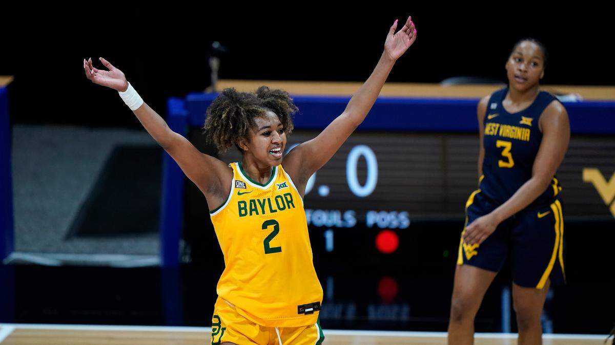Baylor’s DiDi Richards celebrates a basket during the first half of an NCAA college basketball game against West Virginia in the final round of the Big 12 Conference tournament in Kansas City, Mo, Sunday, March 14, 2021. (AP Photo/Charlie Riedel)
