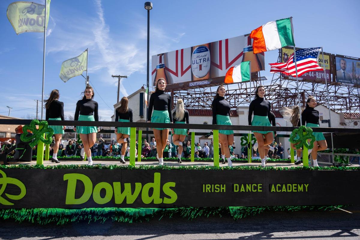 Dowds Irish Dance Academy dance on a flatbed trailer during the Kansas City St. Patrick’s Day Parade on Monday, March 17, 2025.