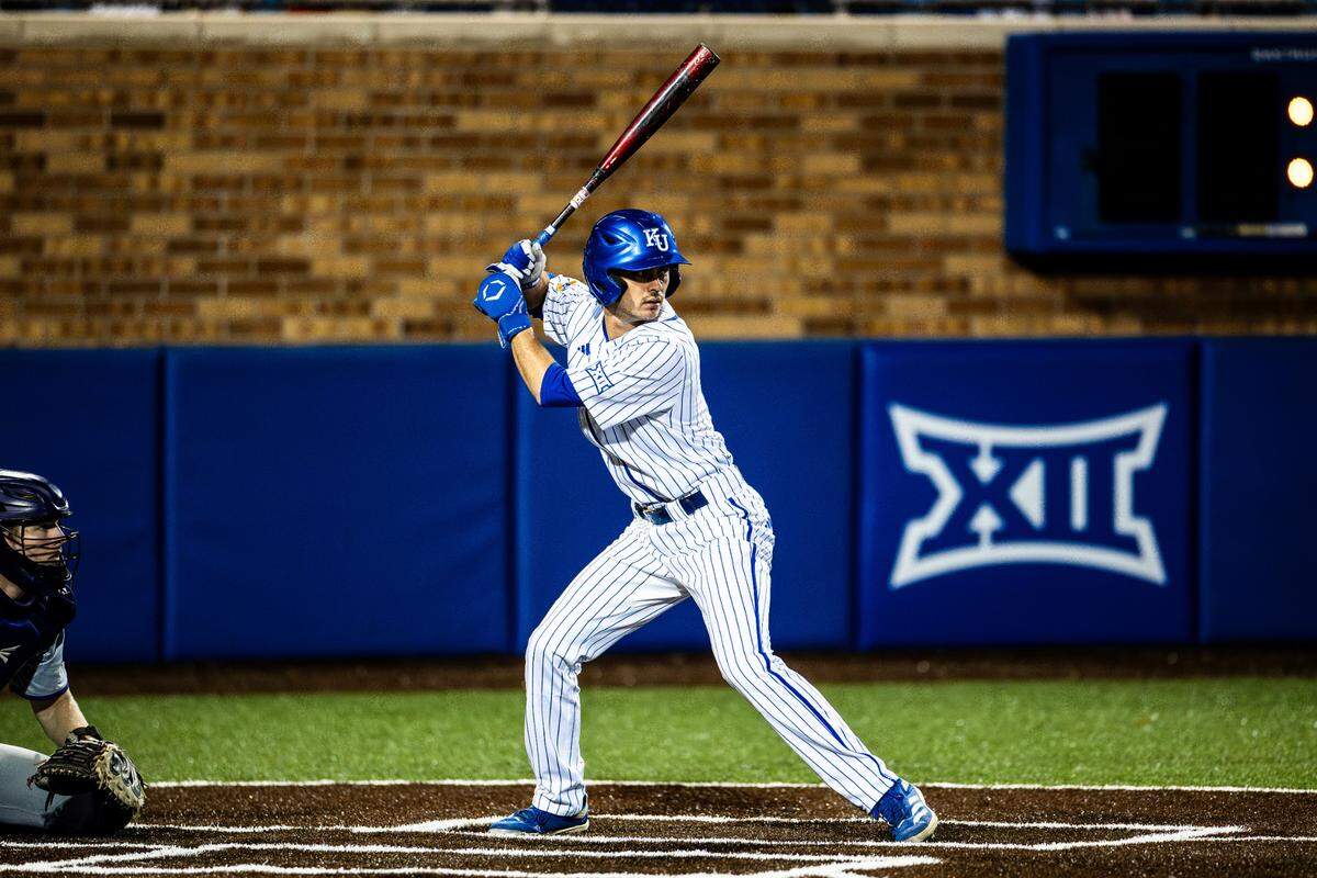 Kansas Jayhawks infielder Chase Diggins bats during a game against Saint Thomas Aquinas at Hoglund Ballpark in Lawrence, Kansas.
