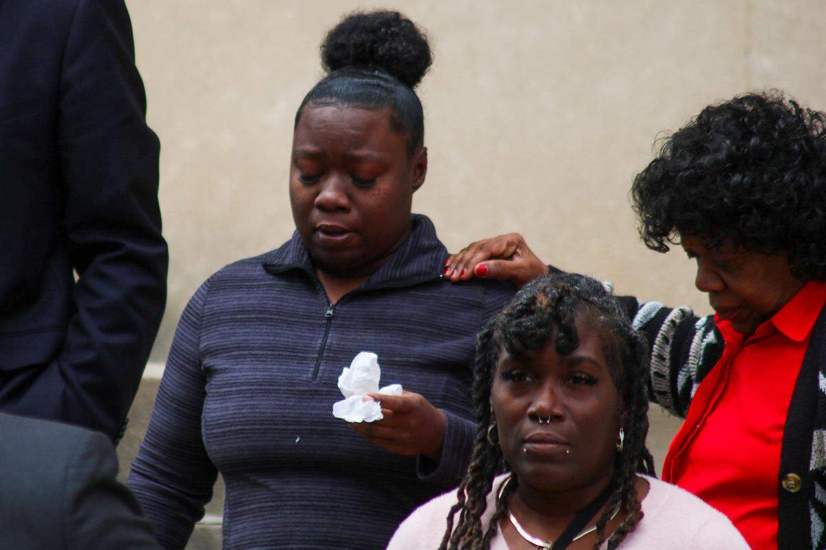 Family of Charles Adair embrace outside the Wyandotte County Courthouse after watching body camera footage of an incident that led to his death.
