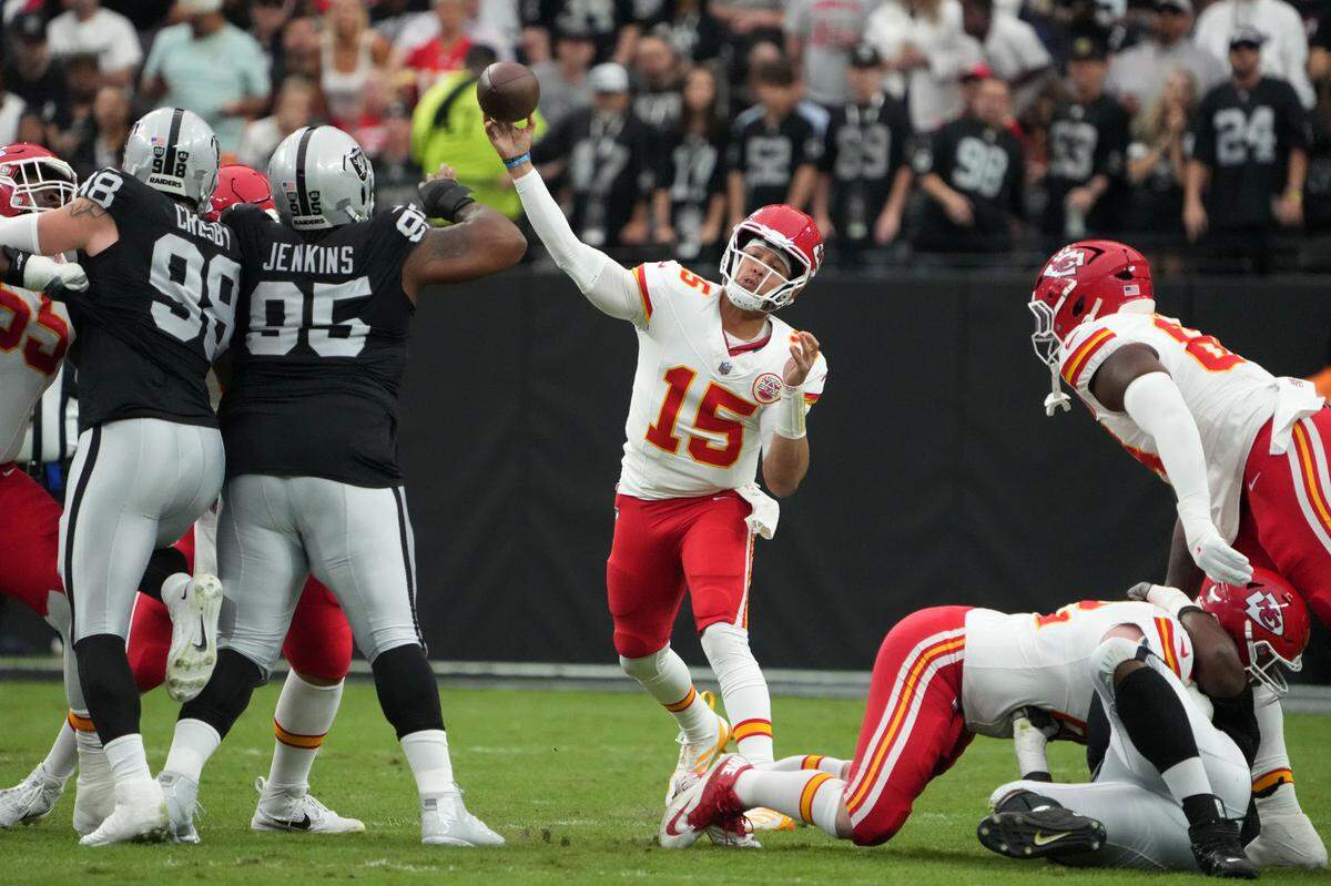 Kansas City Chiefs quarterback Patrick Mahomes (No. 15) heaves a pass against the Las Vegas Raiders during an Oct. 27, 2024 NFL game at Allegiant Stadium in Paradise, Nevada.
