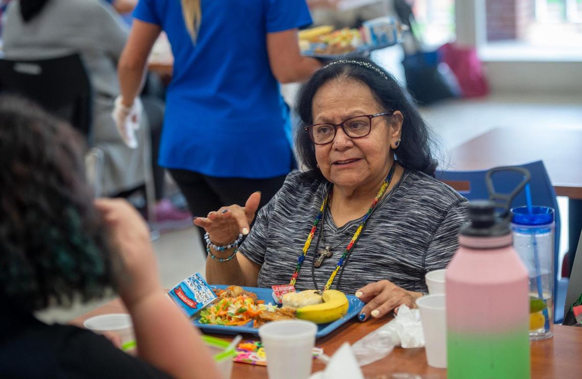 Angela Esteban has a meal at the Don Bosco Senior Center on Thursday, March 27, 2025. Esteban says she lives on less than $2,000 a month with the majority of her income coming from her Social Security retirement benefits.