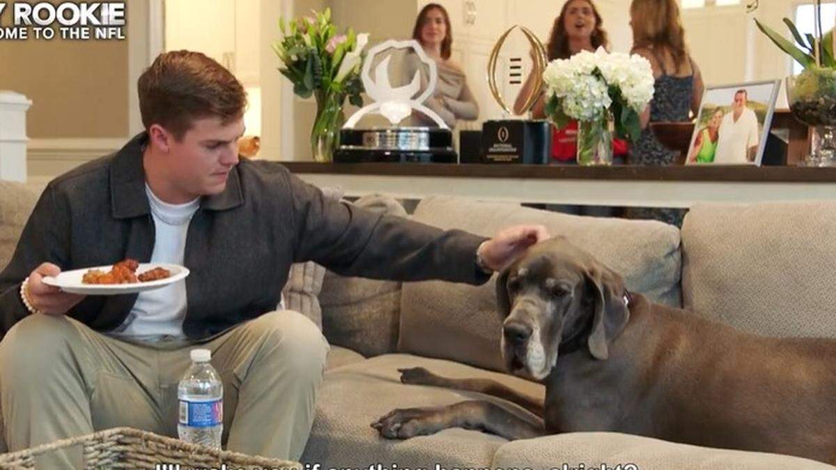 Former Kansas State quarterback Will Howard and his dog during the NFL Draft.