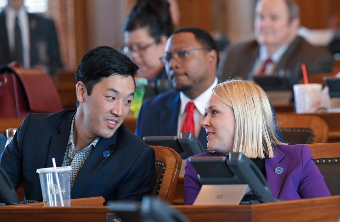 Rep. Rui Xu, left, a Democrat from Westwood, talks with Rep. Jo Ella Hoye, a Democrat from Lenexa, as a special education bill was debated in the Kansas House.