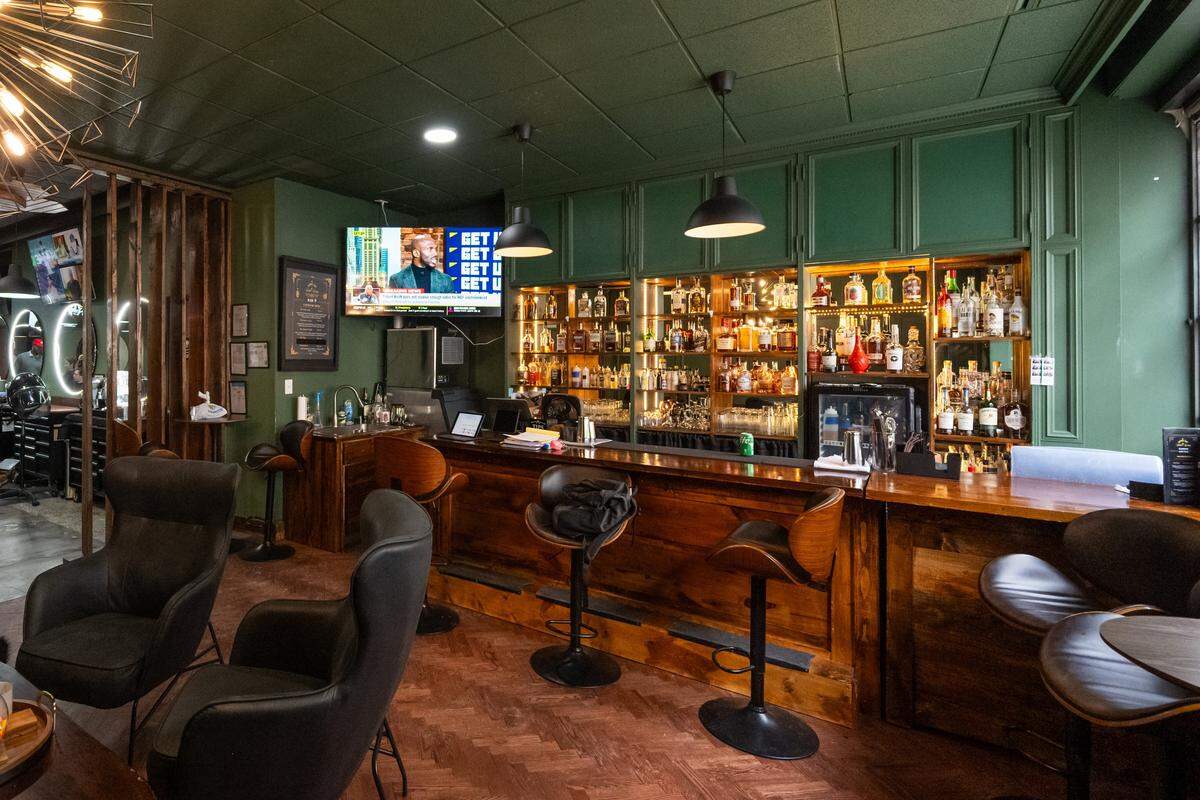 The bar area of Klassic Guy Barber Lounge on 9th, on Tuesday, February 3, 2026, in Kansas City. Customers can come for a shave and also grab a drink.