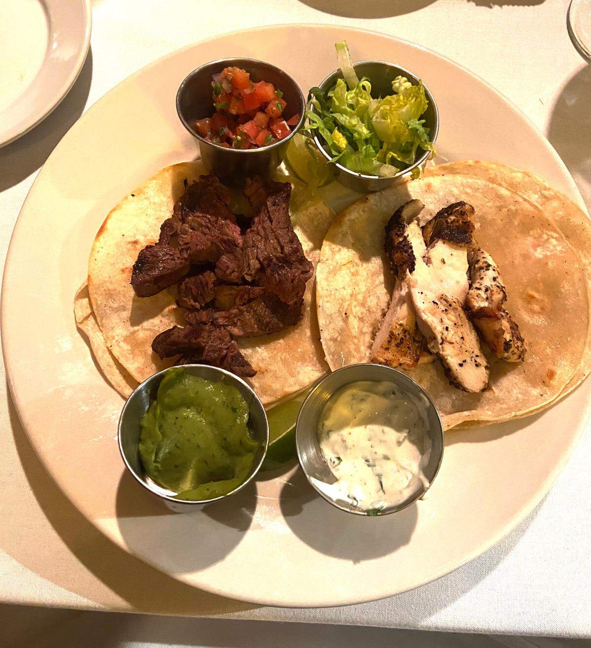 An affordable taco plate ($10) at Piropos offers choices of steak, chicken or fish accompanied by lettuce, pico de gallo, cilantro sour cream and guacamole.