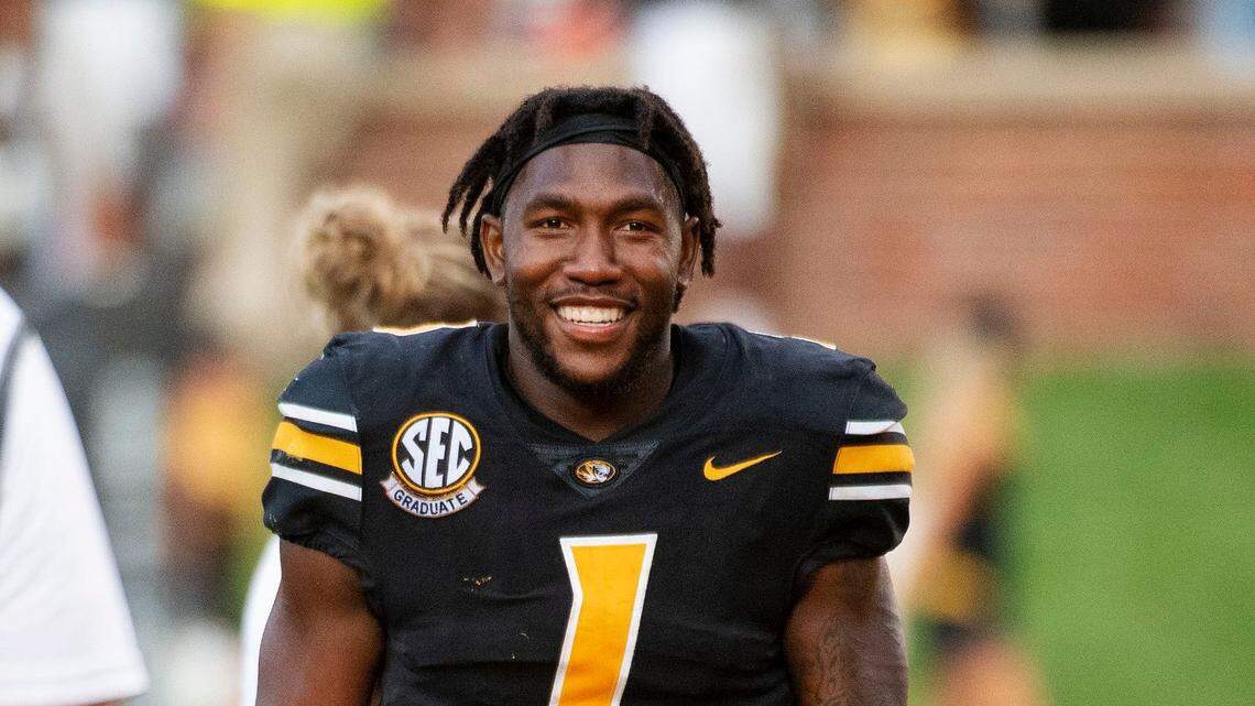 Missouri running back Tyler Badie smiles as he walks off the field after defeating Central Michigan on Saturday, Sept. 4, 2021, in Columbia, Mo.