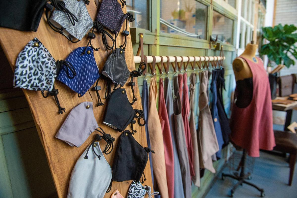 Masks and other linen products inside the Madison Stitch shop in Kansas City’s Crossroads. In the early days of the pandemic, furniture studio Madison Flitch’s owner John Pryor sensed a business opportunity for mask making and hired dozens of stitchers from the local community, many of them refugees.