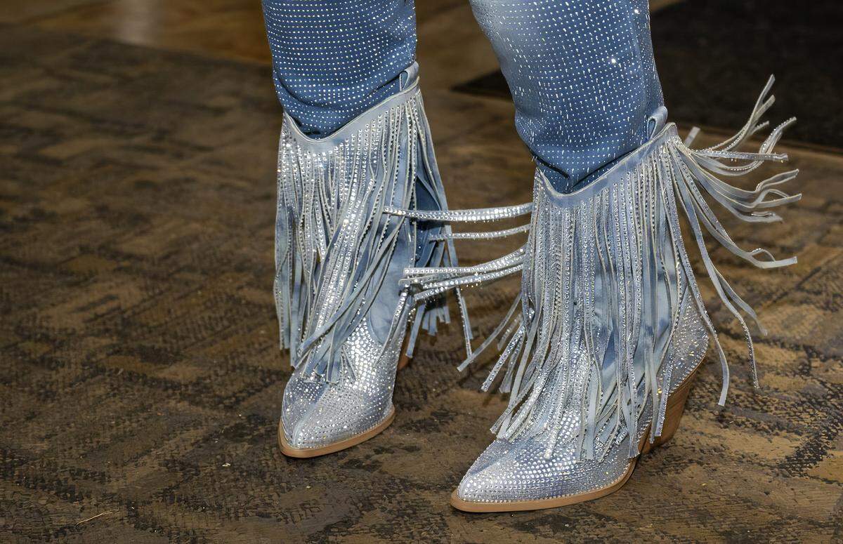 Denise “Ms. Niecie” Ward sports rhinestone and fringe boots while performing during “Dinner & A Show” on Friday, Feb. 6, 2026, at Niecie's Restaurant in Kansas City. Ward takes the stage on the First Friday of every month at her soul food institution.