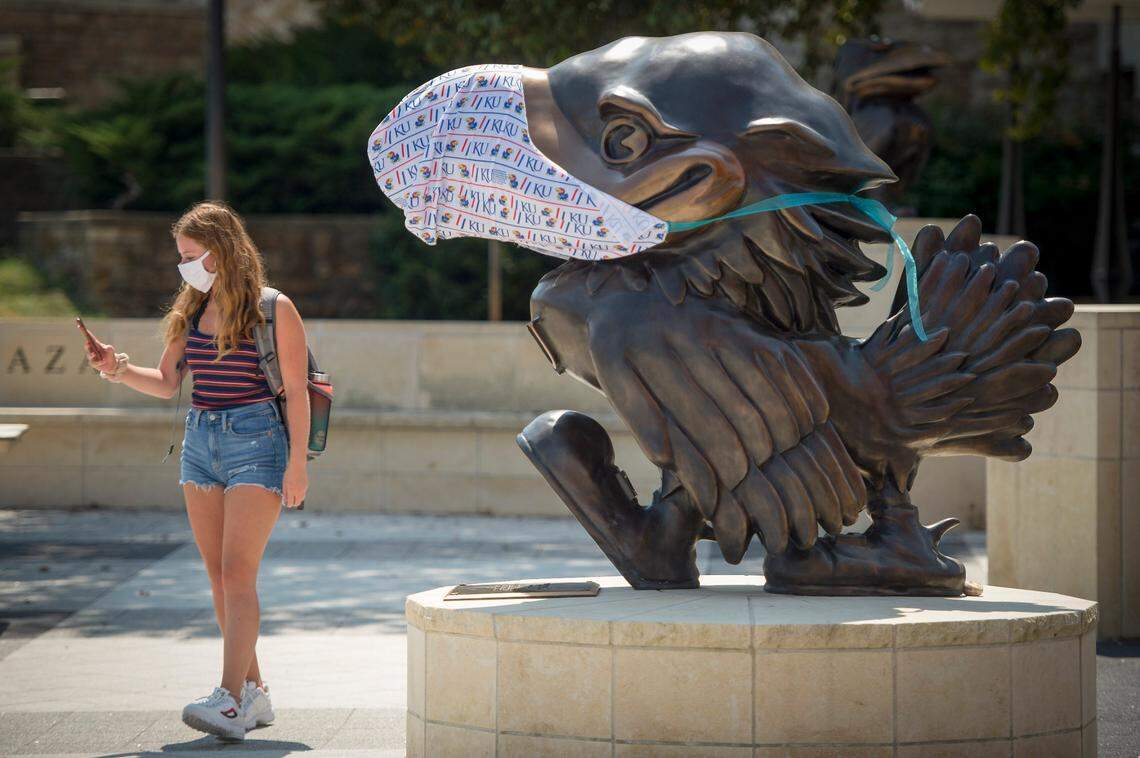 With COVID-19 protocols in place, students including Josie Wiss, 19, a junior from Highlands Ranch, Colorado, returned to the University of Kansas in Lawrence Monday, Aug. 24, 2020, for the first day of classes. Wiss took a selfie with a masked Jayhawk for her mother.