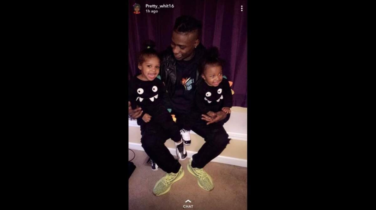 Trenton Washington poses with two of his sons. Earlier this month, Washington, 33, died within a few weeks of arriving at U.S. Penitentiary Leavenworth.
