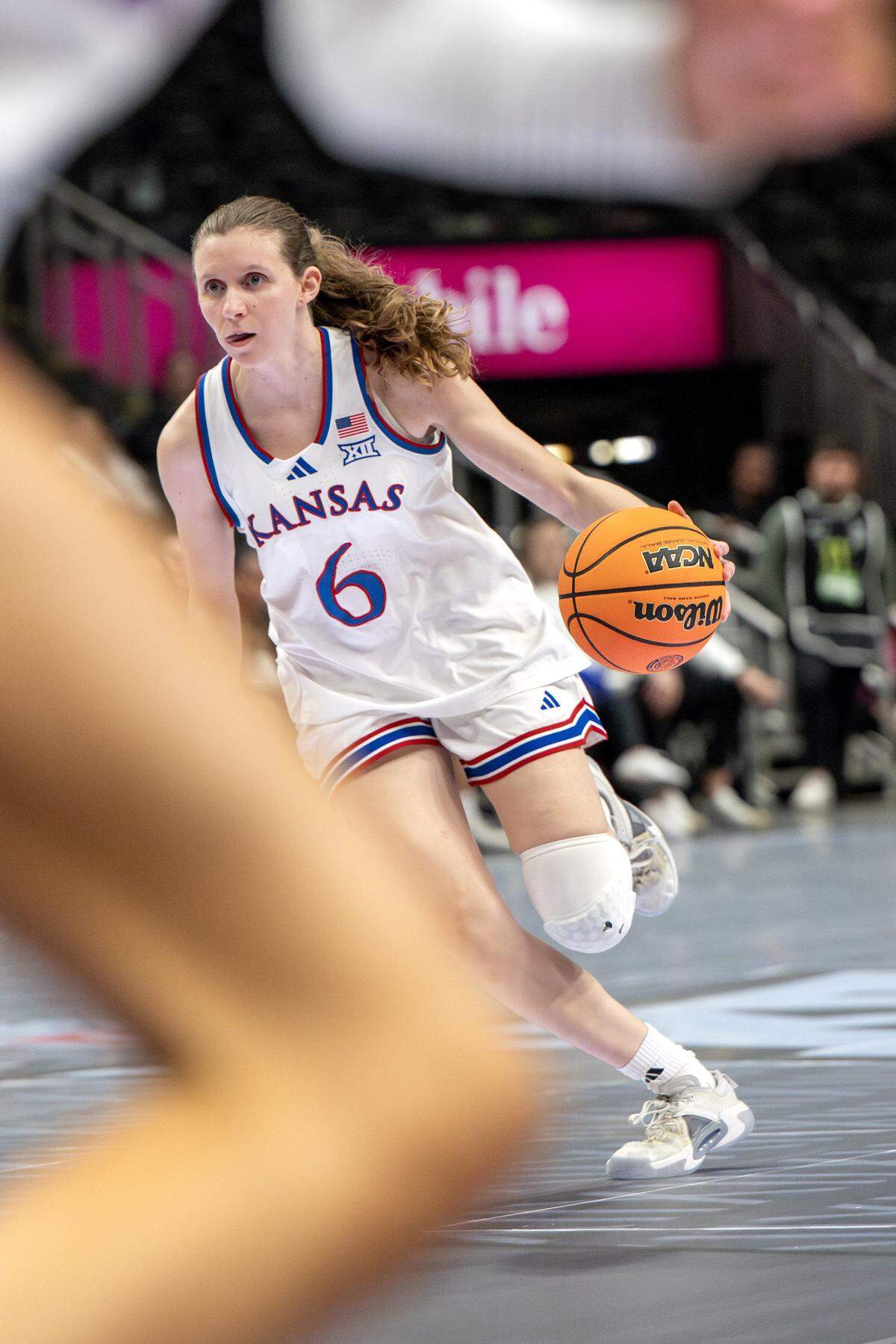 Kansas Jayhawks guard Laia Conesa (6) dribbles up the court against the UCF Knights during the third quarter of the Big 12 Women's Basketball Tournament at T-Mobile Center on Wednesday, March 4, 2026, in Kansas City.