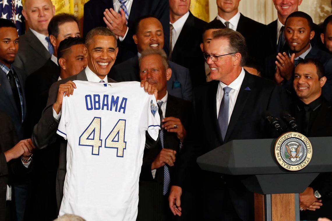 Kansas City Royals manager Ned Yost presents President Barack Obama an honorary jersey at a ceremony honoring the World Series champion Royals in the East Room at the White House on July 21, 2016.