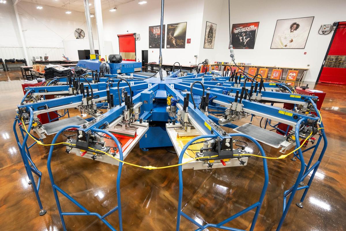 The compound features a full service print shop, that prints posters, massive wall prints, thousands of t-shirts, and other branded merchandise. A state-of-the-art screen printing machine is used to make t-shirts.
