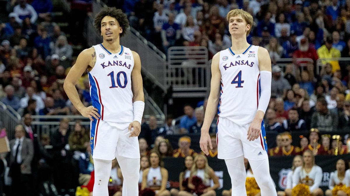 Kansas forward Jalen Wilson (10) and guard Gradey Dick (4) watch a teammates shoot a free throw against Iowa State during the Big 12 Conference tournament Friday, March 10, 2023, in Kansas City.