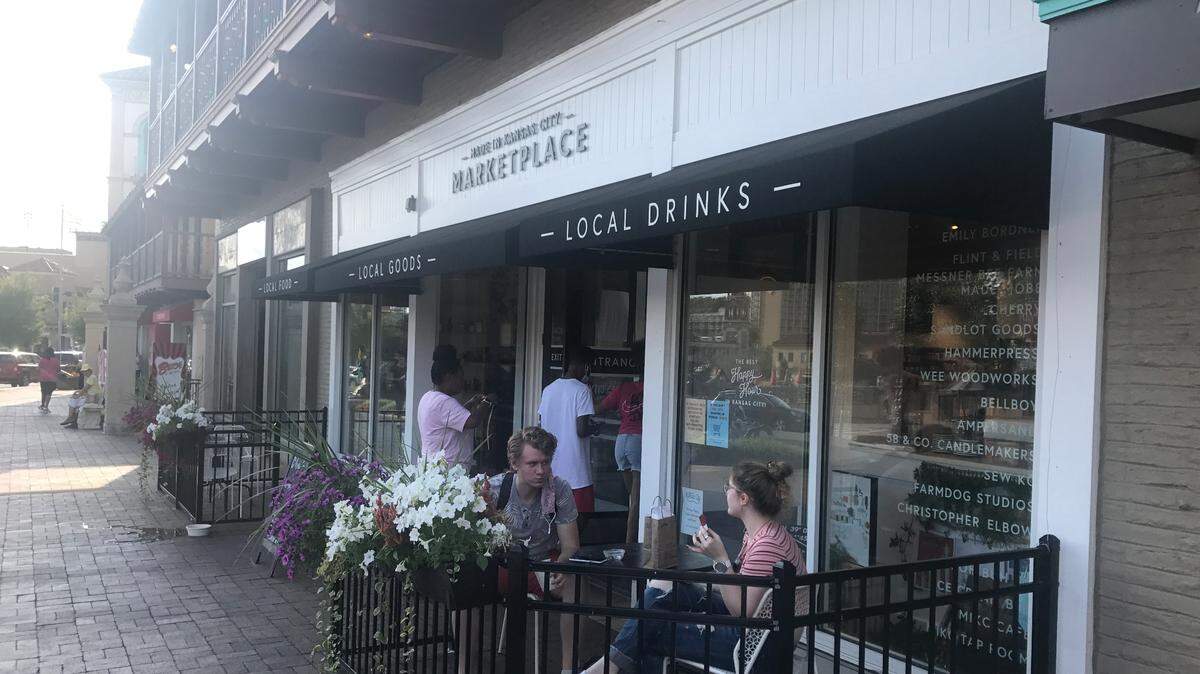 Customers sit outside the Made In Kansas City Marketplace at the Country Club Plaza in 2020. A Made in KC neighborhood shop will open in Overland Park this summer.