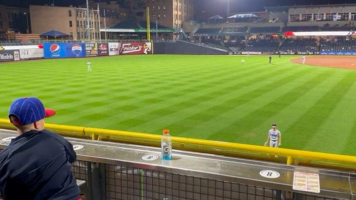 Omaha Storm Chasers outfielder John Raven played catch with a young fan during a break in a game.