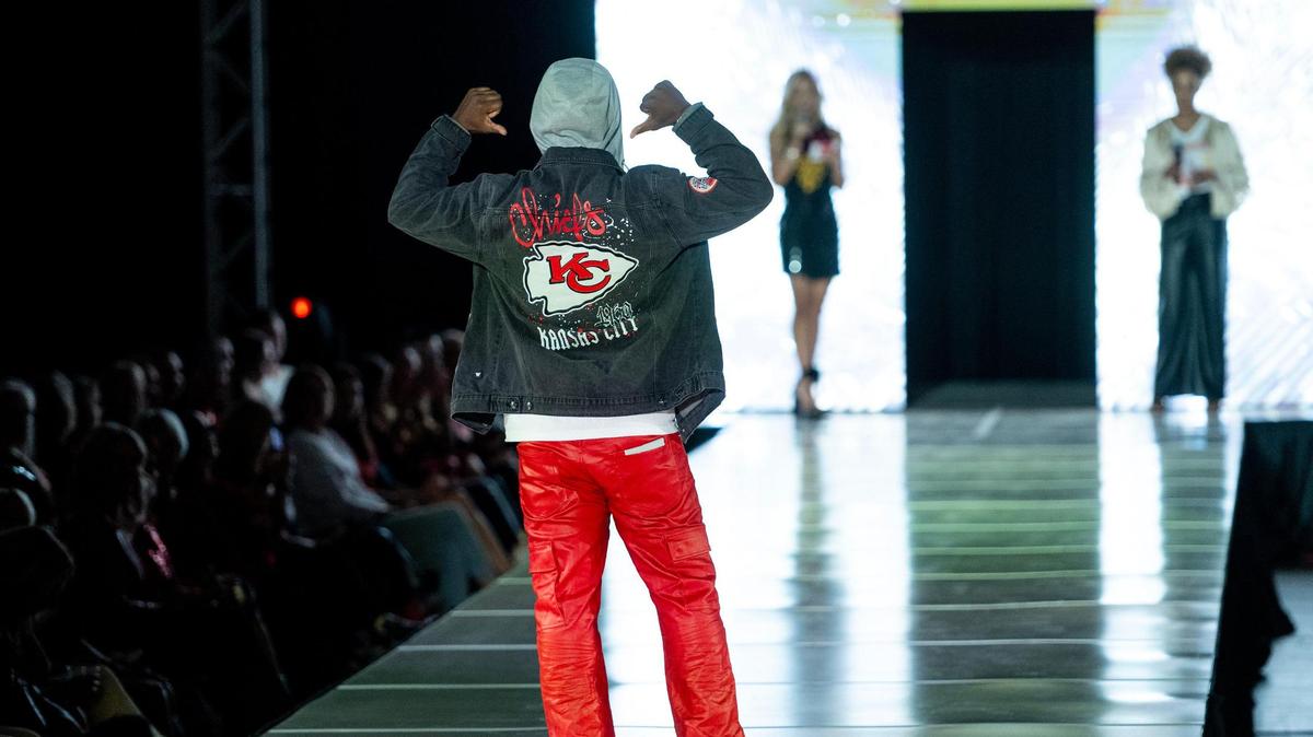 Former Kansas City Chiefs wide receiver Dante Hall models Chiefs clothing during the 12th annual Chiefs Style Lounge on Tuesday, Oct. 17, 2023, in Kansas City.