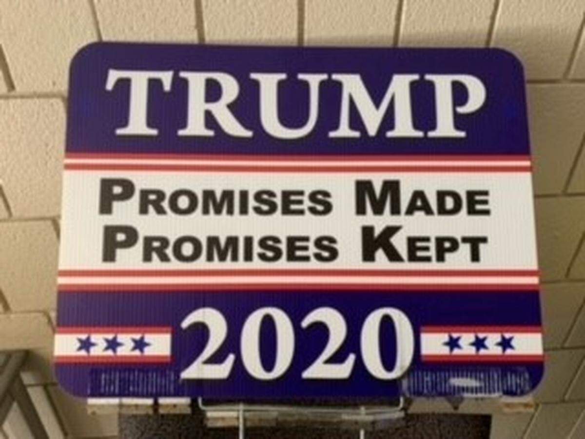 Michigan officials say a township worker was injured while trying to remove a Trump-Pence political sign that was lined with razor blades.