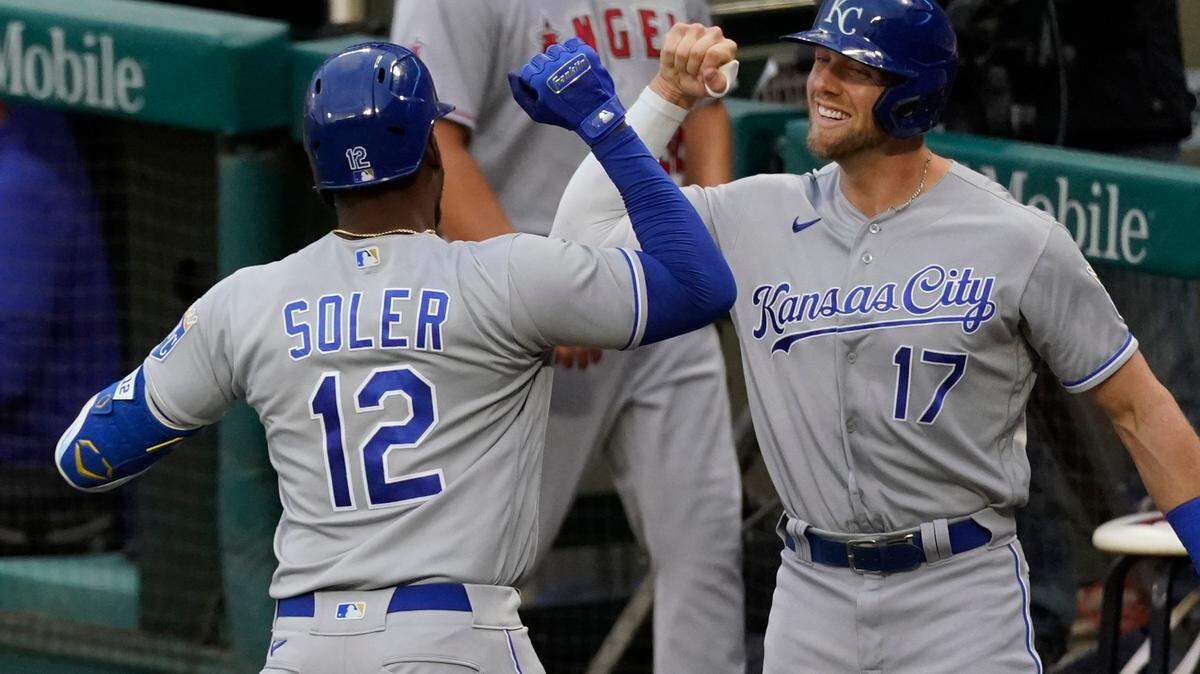 Kansas City Royals designated hitter Jorge Soler (12) celebrates with Hunter Dozier (17) after hitting a home run during the second inning of a baseball game Monday, June 7, 2021, in Los Angeles, Calif. (AP Photo/Ashley Landis)