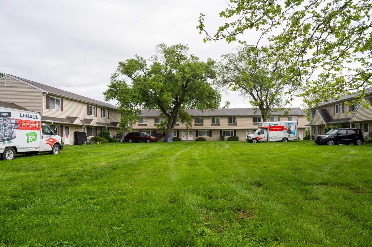 Residents backed up their cars and moving trucks right up to the doors at Aspen Place Apartments in Gardner on Wednesday, May 7, 2025. Residents of the apartment complex were forced from their homes after the city condemned the property, and were given only 48 hours to do so.