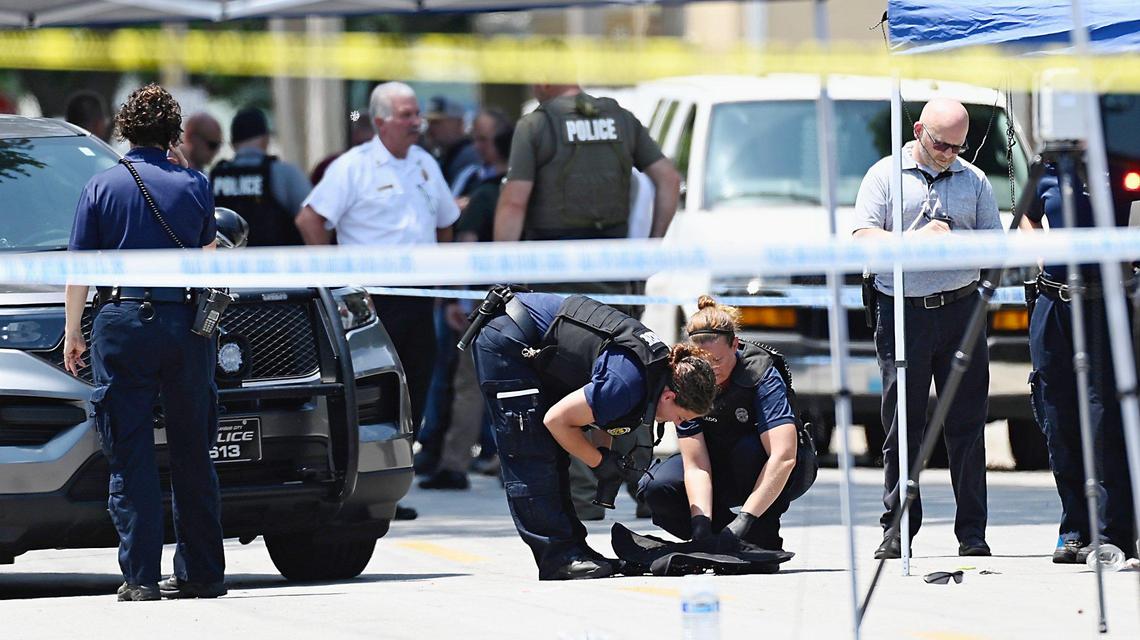 Law enforcement investigated the scene near 21st and Clay Streets in North Kansas City Tuesday after a North Kansas City police officer was shot during a traffic stop. The Missouri Highway Patrol has issued a blue alert with a description and license plate number of a gray car that fled the scene of the shooting.