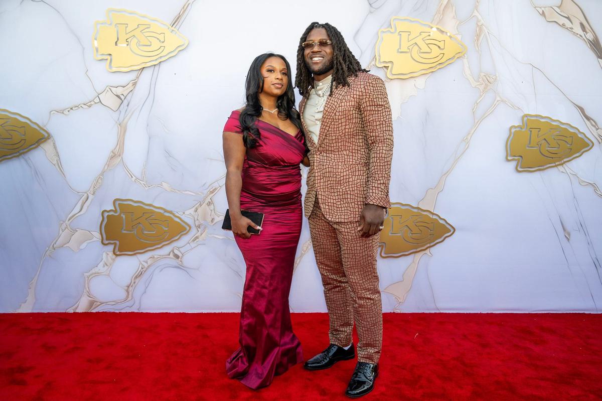 Chiefs linebacker Nick Bolton and date on the red carpet before the Super Bowl LVIII championship ring presentation event.