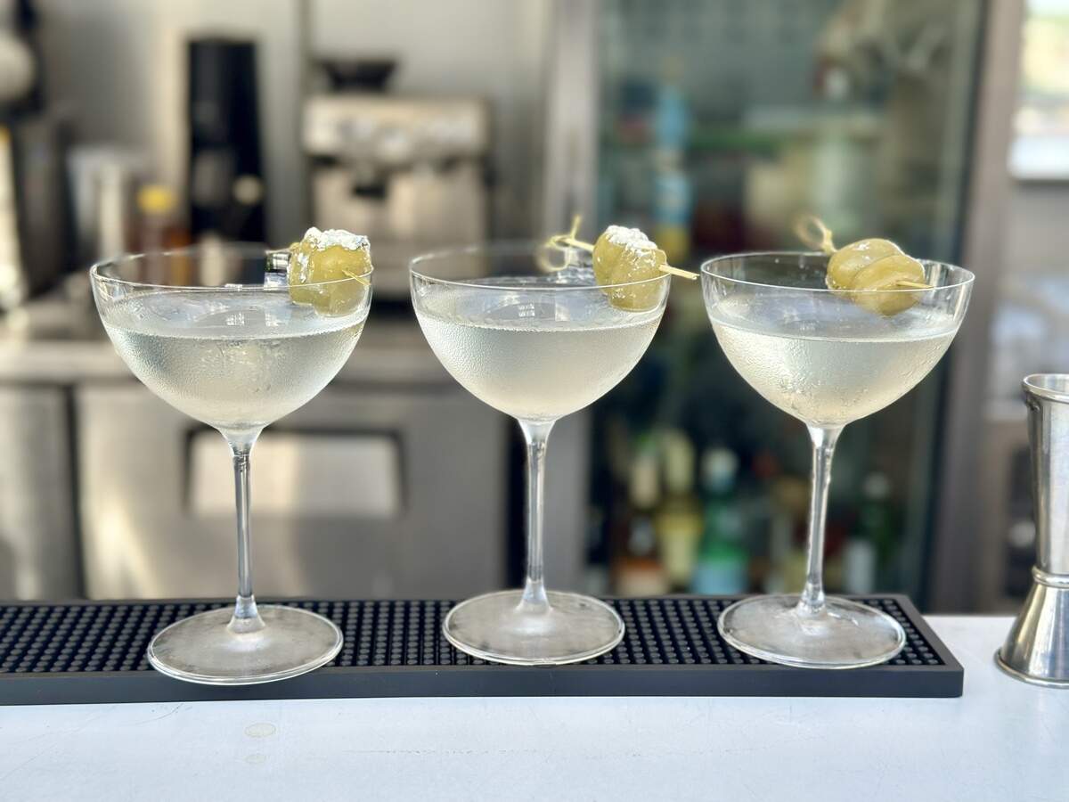 RooftopKC, Kansas City’s newest rooftop bar, serves signature and classic cocktails, like dirty martinis seen here.