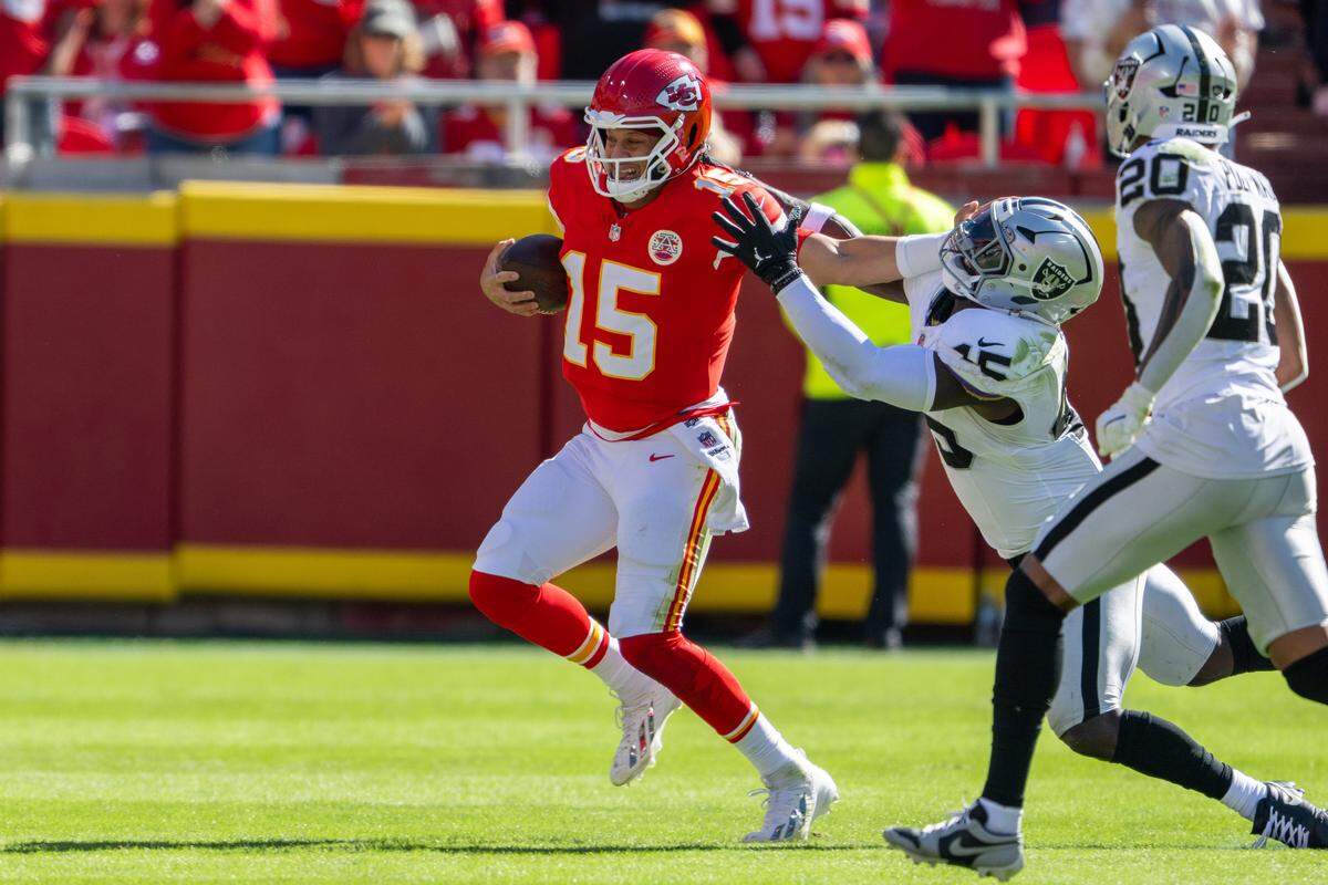 Chiefs quarterback Patrick Mahomes (No. 15) scrambles for a first down during the first half of an NFL Week 7 game vs. the Las Vegas Raiders on Sunday, October 19, 2025, at GEHA Field at Arrowhead Stadium in Kansas City.