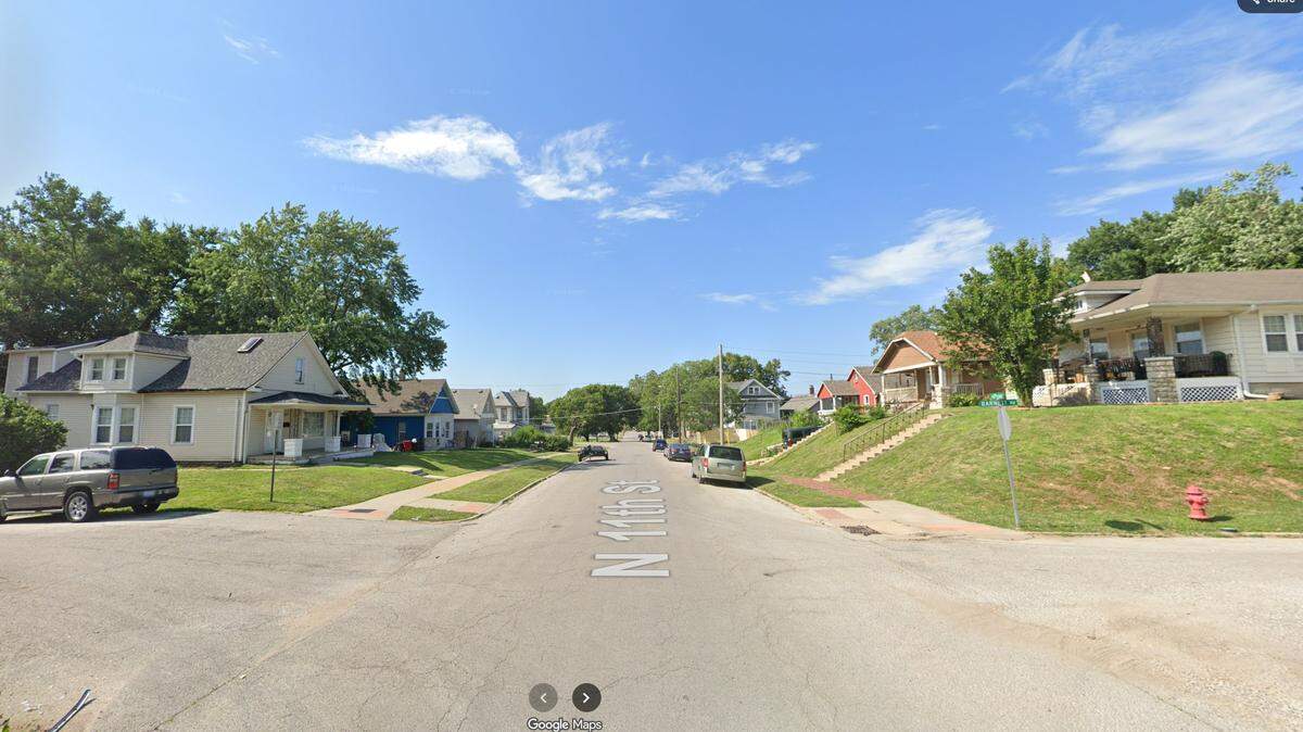 A homicide investigation is underway after a woman was found shot outside a home in the 700 block of North 11th Street in Kansas City, Kansas. She later died at a hospital. This Google Maps Street View image shows the area in 2024.