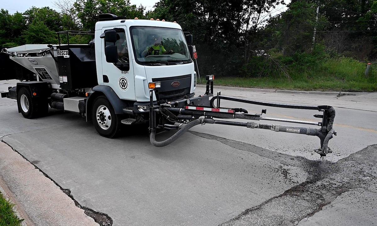After blasting out all debris from a potehole with highly compressed air, this spray pothole patching vehicle, now being used by the Kansas City, Kansas Public Works Department, sprays a hot asphalt mix into the hole and then covers it with crushed rock. The work is completed by one person, who operates the machine from the vehicle’s cab. In some cases, the new vehicle can patch potholes in as little as two minutes. KCK Public Works is having a contest to name the newfangled machine. To vote, visit wycokck.org/NameThePatcher or dial 3-1-1. Voting will close on July 1.