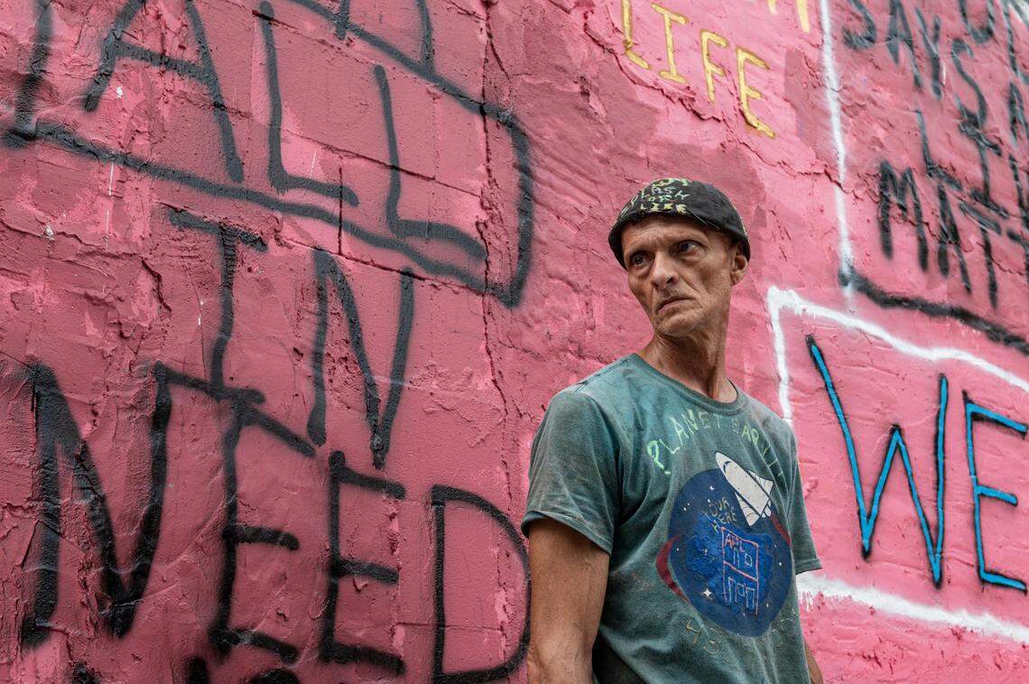 Owner Jerry Crowell stands in front of the iconic pink building on Troost Avenue in Kansas City that will be removed from dangerous buildings list.
