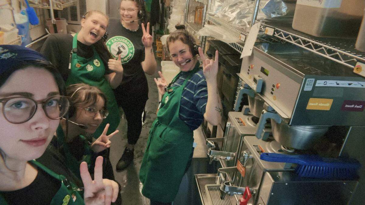Alydia Claypool, far left, poses with her colleagues at the newly unionized Overland Park Starbucks store at 75th Street and I-35 on Tuesday, March 12, 2024.