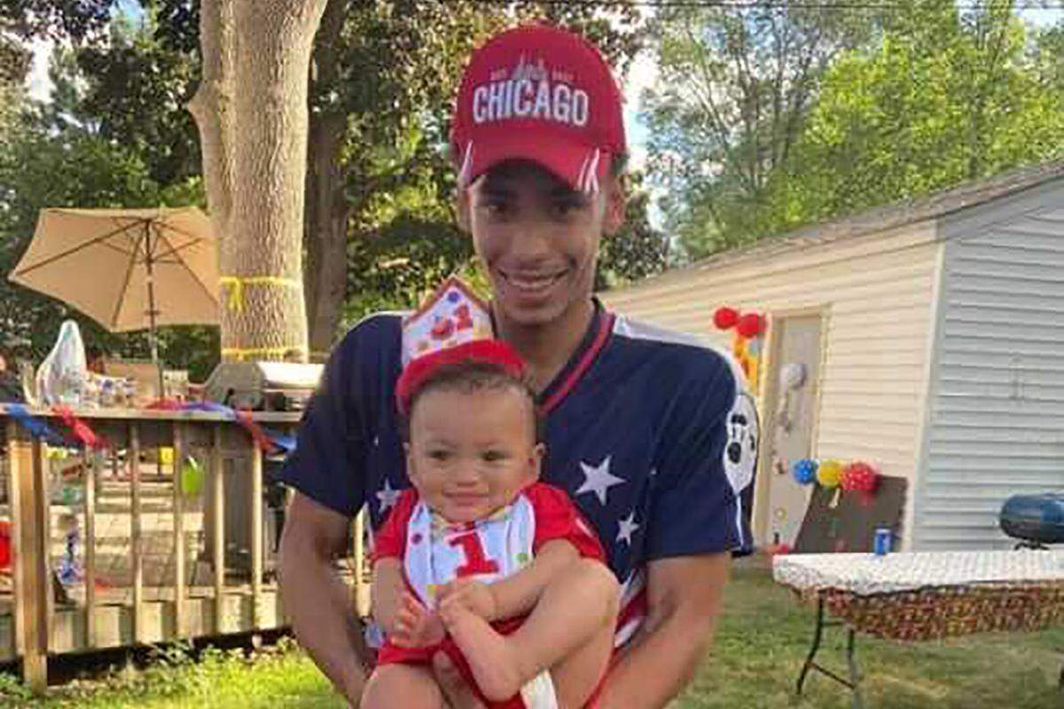 FILE - This photo provided by Ben Crump Law, PLLC. shows Daunte Wright and his son, Daunte Jr., at his first birthday party. Wright, 20, was killed during a traffic stop by&nbsp;a white suburban Minneapolis police officer on Sunday, April 11, 2021. (Ben Crump Law, PLLC. via AP)