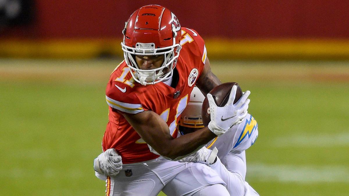 Kansas City Chiefs wide receiver Demarcus Robinson makes a catch for a first down and fights for yards as Los Angeles Chargers cornerback Michael Davis tackles him in the third quarter of the Chiefs game against the Los Angeles Chargers at Arrowhead Stadium Sunday, Jan. 3, 2021. The Chargers defeated the Chiefs 38-21.