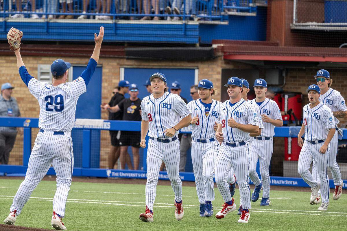 Kansas Jayhawks pitcher Boede Rahe (29) celebrates with teammates after striking out a batter to secure a 6-3 win over the Northeastern Huskies during an NCAA baseball tournament game at Hoglund Ballpark on Friday, May 29, 2026, in Lawrence.