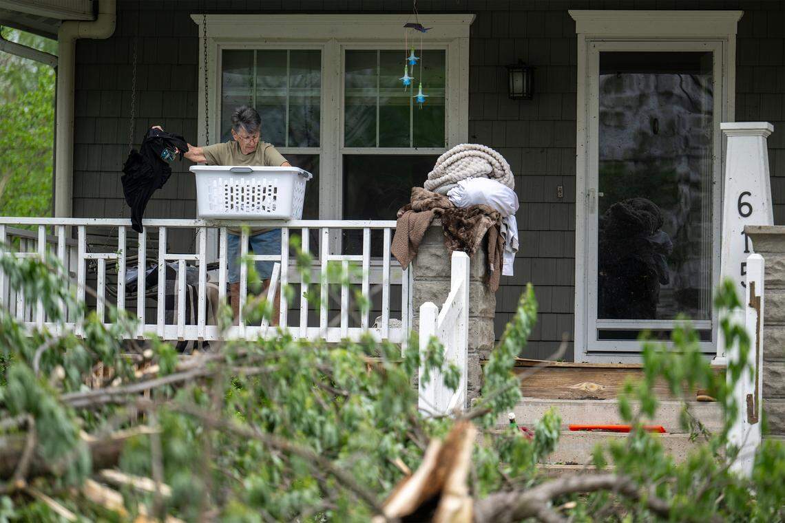 Tree debris littered the yard as cleanup efforts were underway in the 600 block of East Bodine St., in Clinton Missouri, on Thursday, April 16, 2026, after a tornado touched down in Henry County late Wednesday afternoon.