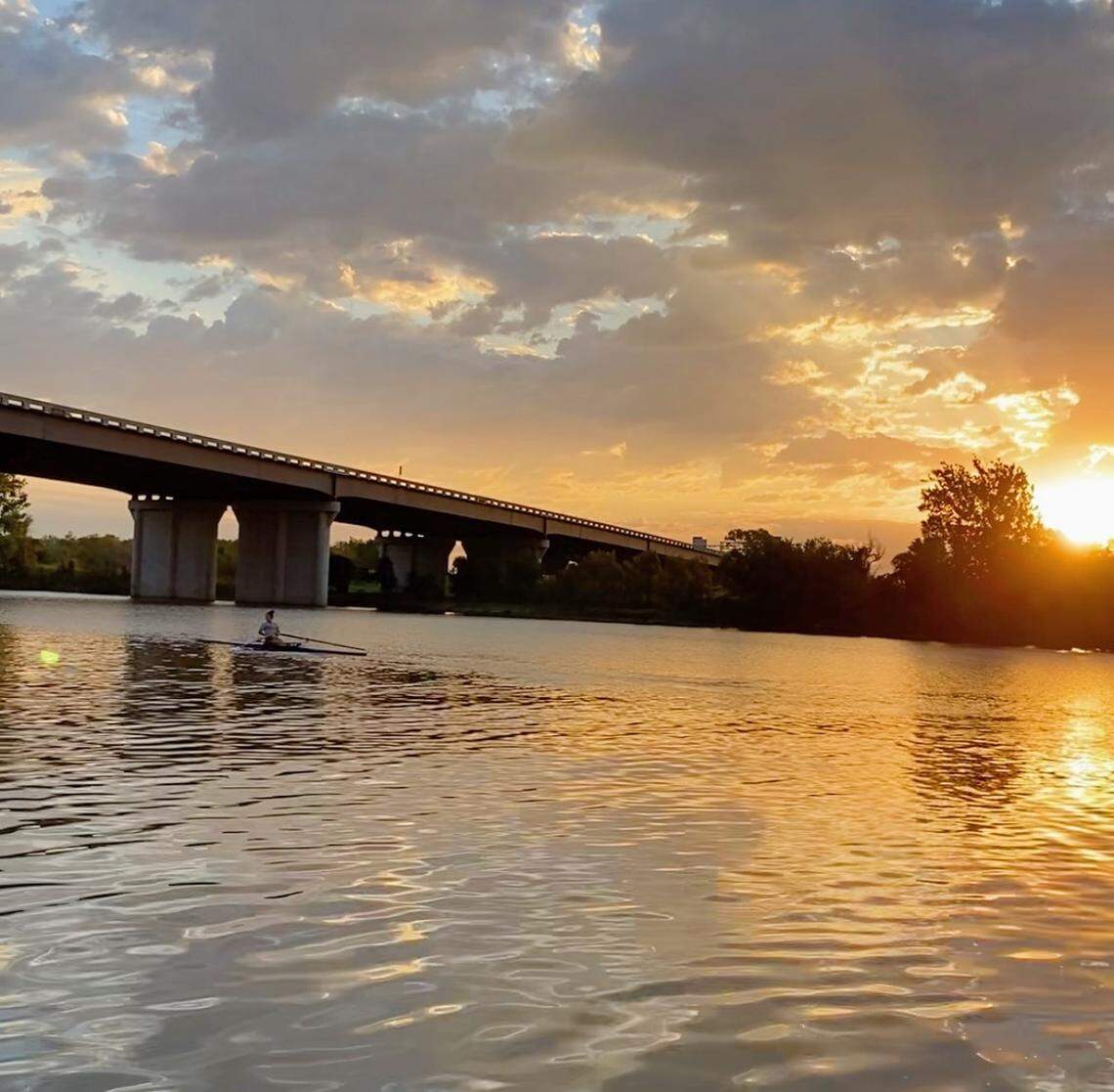 Isabela “Izzy” Estes rows a single on the Kansas River, where the University of Kansas women’s rowing team practices, at sunset in the Fall of 2022 in Lawrence.