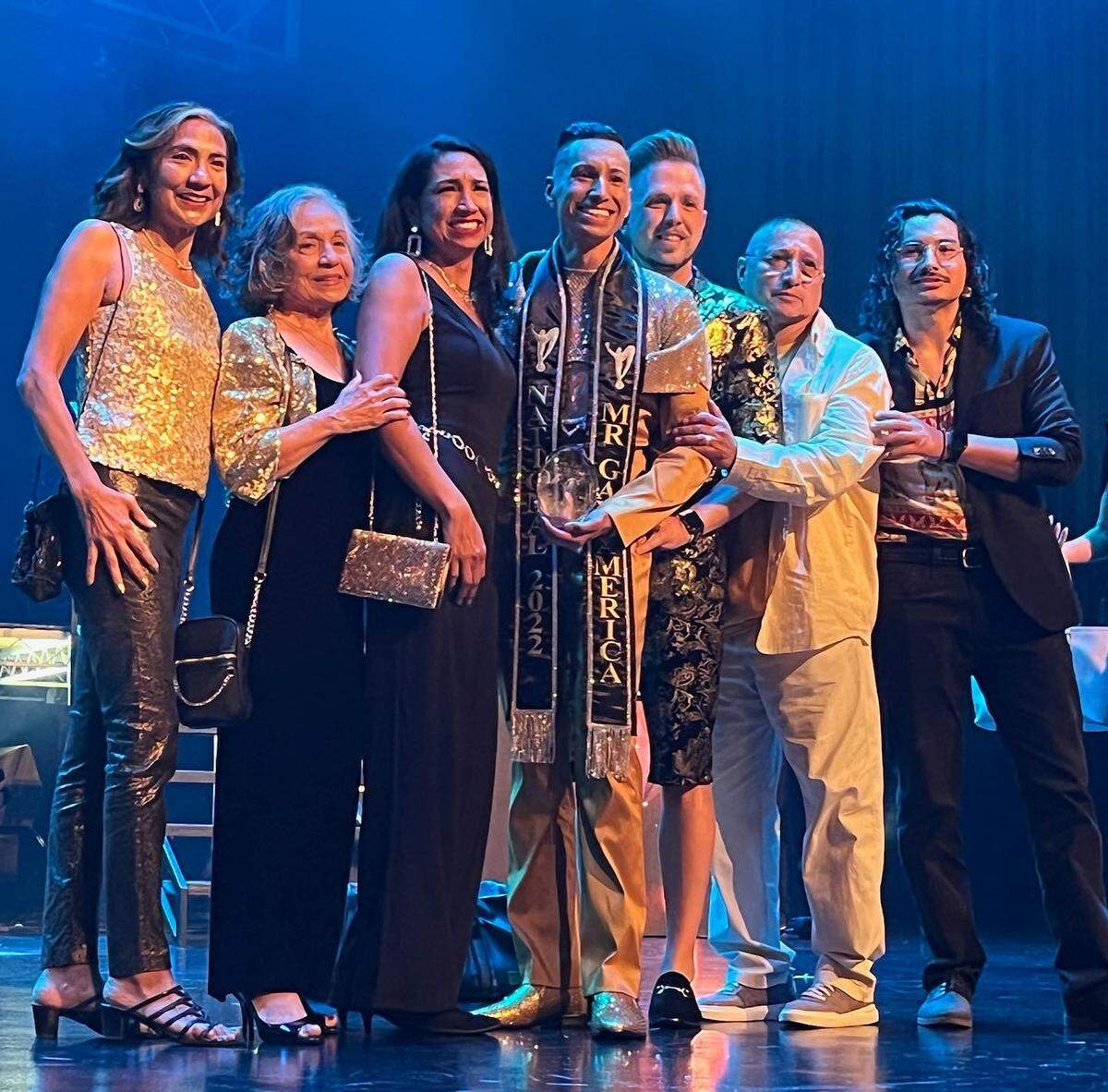 Aniseto Herrera smiles with his family at the Mr. Gay America competition.